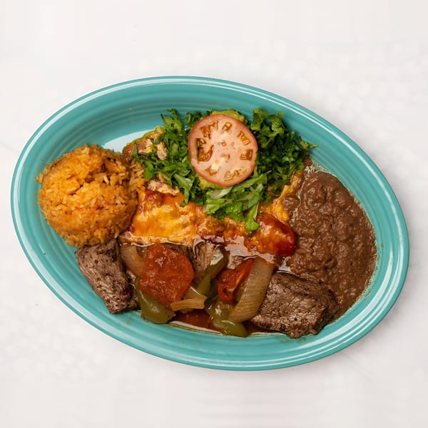 El Chaparral Mexican Restaurant's colorful platter with rice, beans, steak, and vegetables.